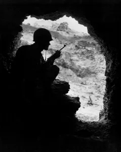 Snipers Prints: Marine rifleman positioned in an cave to pick off Japanese snipers in the surrounding ridges