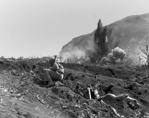 Island Prints: Marines blast Jap positions near the base of Mount Suribachi on Iwo Jima
