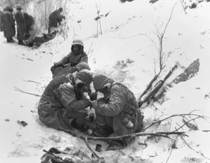 Frozen Prints: Marines exhausted from their five days and nights of battle with Chinese take a rest with a warm beverage