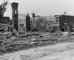 Snipers Prints: Marines fire at Japanese snipers concealed in the ruins of a building in Naha