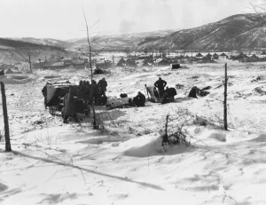 Frozen Prints: Marines seek shelter from the cold in and around vehicles at a post in Kotori during the Dec