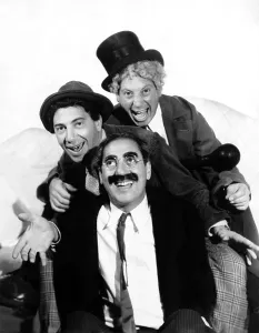 Top Hat Prints: MARX BROTHERS, THE (Chico, Groucho and Harpo) pose for a publicity portrait during production of A NIGHT AT THE OPERA