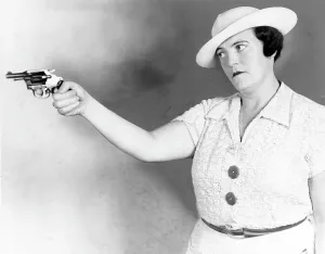 Revolver Prints: Mary A. Shanley, New York City detective, holding service revolver