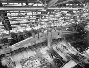 Machinery Prints: Massive wing of a B-19 Bomber under construction in a during World War 2 in 1941