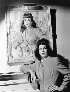 September Prints: Maureen O'Sullivan standing beside her portrait, ca. 1941