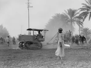 Pulling Prints: Medical College, tractor pulling a cart to the Baghdad and road building