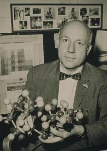 Chemistry Prints: Melvin Calvin (1911-1997 ), 1961 Nobel Prize winning American Chemist holding a model of the sucrose molecule