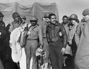 Members of the 99thth Fighter Squadron of the Army Air Forces, a famous African America unit. They are on the Anzio beachhead, Feb. 1944, during World War 2