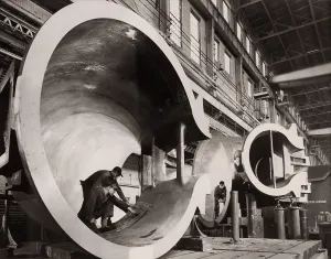 Development Prints: Men in the casing sections of giant turbines during construction at the Hungry Horse Dam in Montana