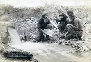 Mining Prints: Three men, with dog, panning for gold in a stream in the Black Hills of South Dakota in 1889