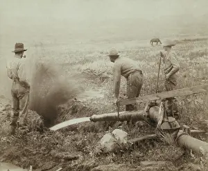 Migration Prints: Three men engaged in hydraulic gold mining in Rockerville