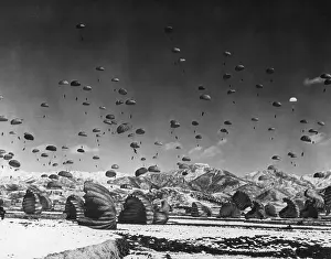 Parachutes Prints: Men and equipment being parachuted to earth in an operation conducted by United Nations airborne units