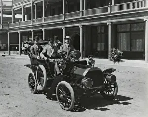 Convertible Prints: Four men in a Government automobile in front of the Adams Hotel