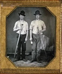 Images Dated 10th December 2007: Two men holding floor rammers, foundry tools used for packing sand against molds