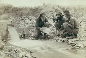 Migration Prints: Three men panning for gold in a stream in the Black Hills of South Dakota in 1889