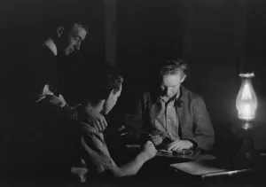 Images Dated 6th March 2012: Men play cards by the light of a kerosene lantern. Pie Town, Mexico, 1939