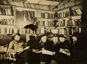 Books Prints: Men reading in Byrds First Antarctic Expedition basecamp library