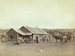 Migration Prints: Men and a woman in front of a western ranch house, in South Dakota, 1887