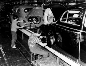 Automobile Prints: Men work on the assembly line at a Volkwagen factory