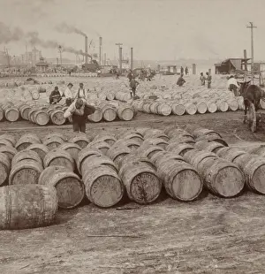 Port Prints: Men work among thousands of barrels of sugar on the levee in New Orleans