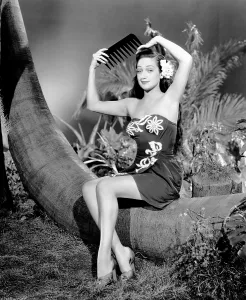Sarong Prints: ON OUR MERRY WAY, Dorothy Lamour, with an oversized comedy comb, 1948