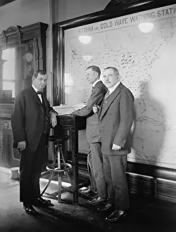 Speed Prints: Meteorologists at the U.S. Weather Bureau stand in front of a map of the 48 states in 1924