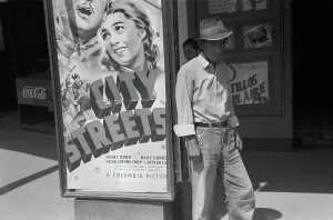 Coca Cola Prints: Mexican man in front of a movie theater playing CITY STREETS