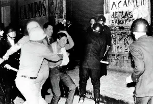 Hurt Prints: Mexico City: Riot police battle a student demonstrator in a night of violence that ended with Mexican Army troops using