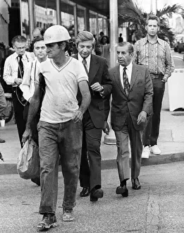 Miami Meyer Lansky (right), reputed underworld financial operator, walks along a Miami street February 26, 1973