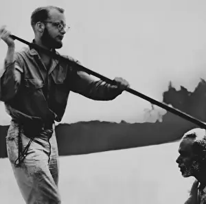 Native Prints: Michael Rockefeller, in a canoe with a native during his anthropological exploration in Dutch New Guinea