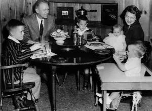 Dinner Prints: Michigan Representative Gerald Ford has dinner with wife Betty and their four children Mike