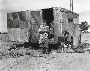 Shack Prints: A migratory family living in a trailer in an open field
