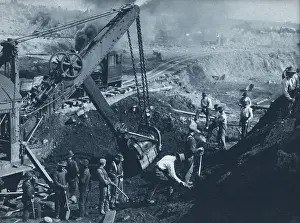 Workers Prints: Miners working near a steam shovel in an iron ore strip mine