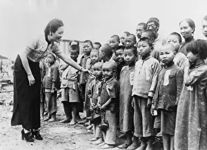Rs3rn Prints: Mme. Chiang Kai Shek with orphans she adopted after Japanese air raids of Aug