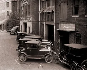 Classic Prints: Model Ts, and one more luxurious Lincoln (center front) are parked by a Ford Motor Company dealership in Washington
