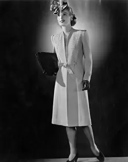 Coat Prints: A model wearing a dressy coat by Cymonette