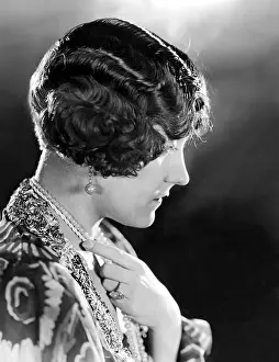 1920s Fashion Prints: Model wearing her hair in The Glorias Bob, orginated by Gloria Swanson, 1923