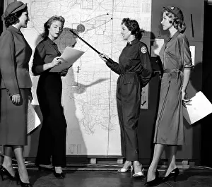 Models Prints: Models exhibit the new blue uniforms for women volunteers in Federal Civil Defense Agency (FCDA)