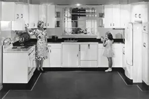 Electricity Prints: Modern electric kitchen with a stove and refrigerator