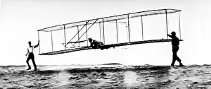 Orville Prints: The modified No. 3 Glider (1902) being launched at Kill Devil Hill