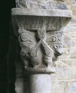 Monastery of Sant Mart del Canig. Cloister. 11th c. - 13th c. FRANCE. Casteil. Abbey of Sant Mart del Canig. Cloister capital with profane scene. Romanesque art. Relief on marble