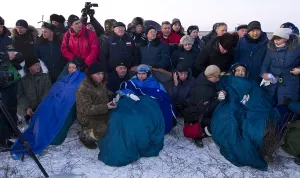 Spacesuits Prints: After five months in space, space travelers recline in chairs the Soyuz TMA-02M capsule after they landed in Kazakhstan