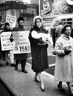 Nuclear Weapons Prints: A Mother carries her baby as she participates in a pacifist demonstration
