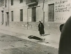 Dead Body Prints: A mother looks on the body of her son in a street of Castillon