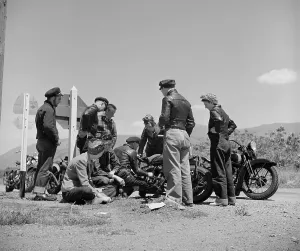 Motorcycles Prints: Motorcycle party stopped for roadside repairs