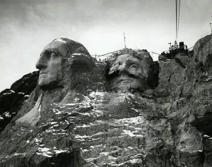 Granite Prints: Mount Rushmore sculptures of Washington and Jefferson with finished faces ca
