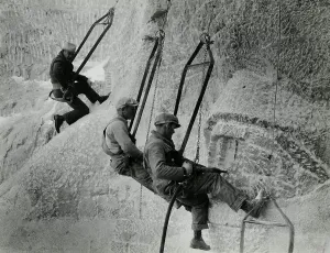 Carving Prints: Mount Rushmore workers hanging in swing seats