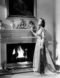 Hostess Gown Prints: THE LAST OF MRS. CHEYNEY, Joan Crawford, in a hostess gown designed by Adrian, 1937