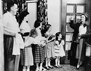 Papers Prints: Mrs. E. J. Siegwarth, Jr. waving good-bye to her family as she leaves for work
