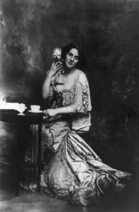 Campbell Prints: Mrs. Patrick Campbell, (1865-1940) English actress, holding pet dog. 1901